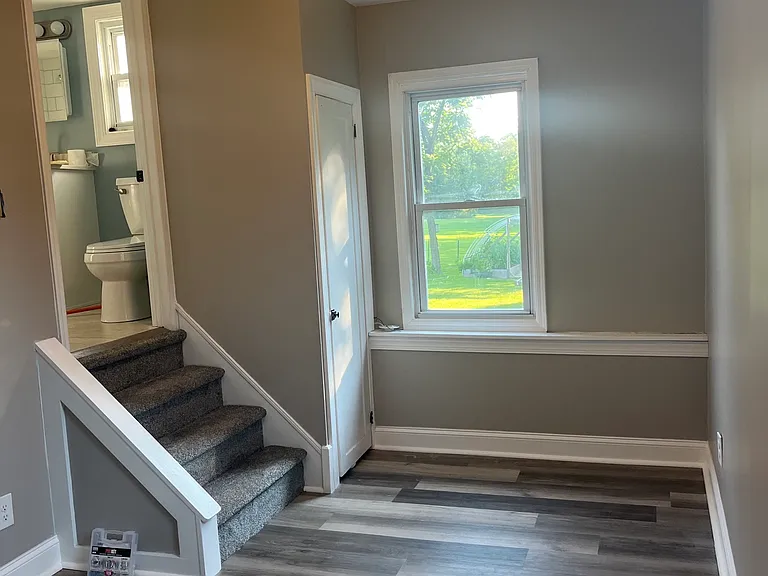 Living space & steps to bathroom