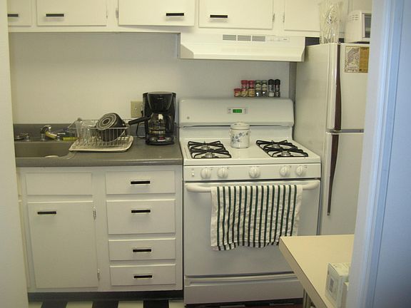 Separate kitchen with gas stove.