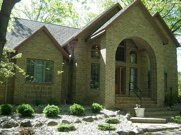 Impressive 2 story brick and cedar home.  Screened by nature in a park like setting.  The 2 story entry says "welcome"....a place to hang your heart!
