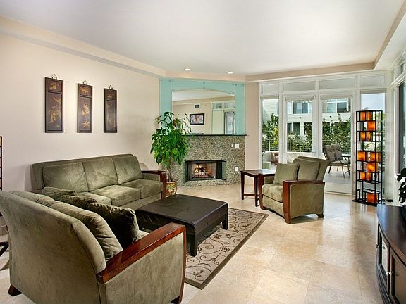 Travertine Floors, Marble Fireplace, Window Walls