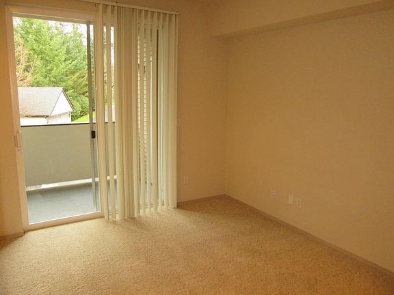 Master bedroom with large glass slider to the balcony.