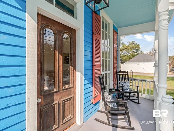 Property entrance with covered porch