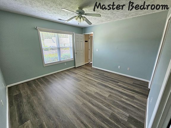 View of 1st bedroom from bathroom entrance