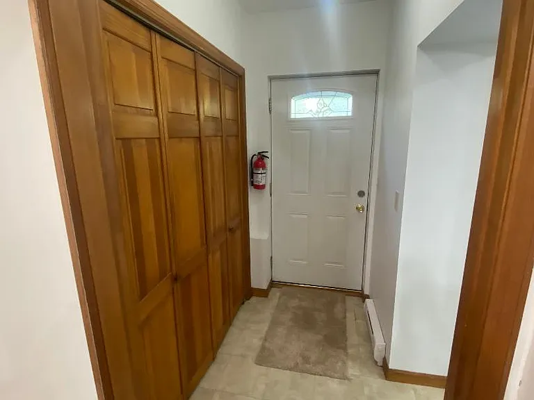Entry foyer with double door storage closet