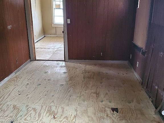 New floors. Clean, empty kitchen