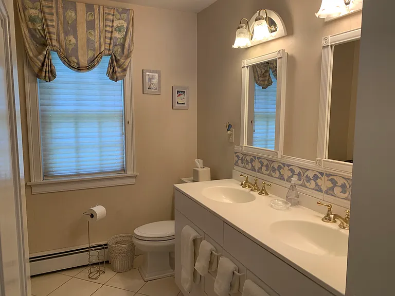 Primary Bedroom en suite bathroom. Double sink vanity and tub/shower combo.