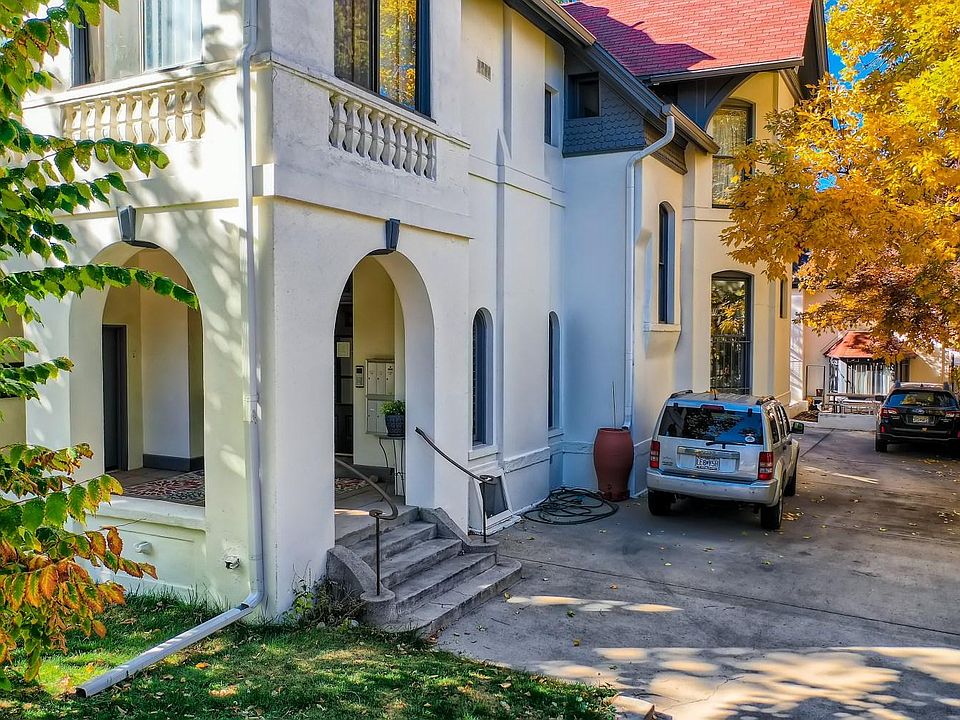 2-building complex with carriage house in the rear. Mail accessed at front porch of main building. Laundry is in the basement of this building.