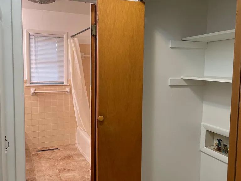 Laundry alcove and hallway bathroom
