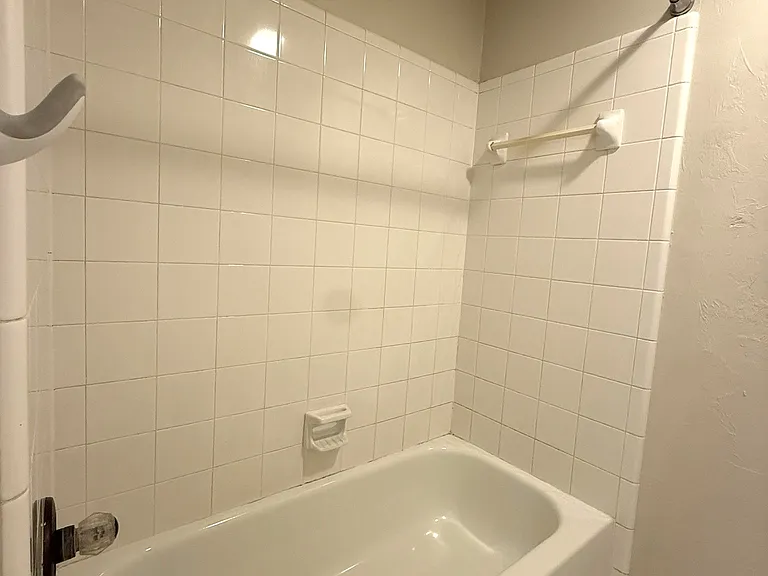 Upstairs bathroom tub/shower combo. Get ready to pick your own shower curtain!
