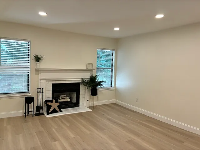 Livingroom with a fireplace and new hardwood floors