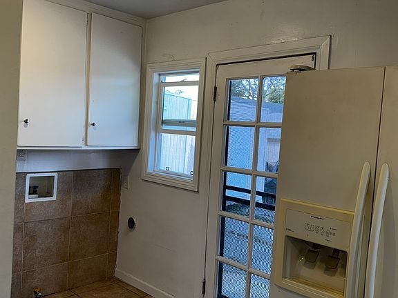 Kitchen side door and the Laundry hook ups.