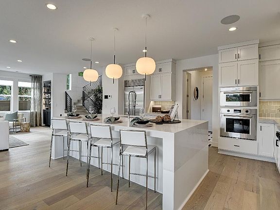 Well designed kitchen with walk-in pantry behind