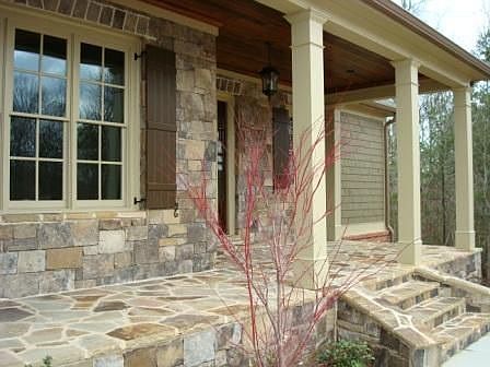 Imagine relaxing in your rockers or swing on this front porch.