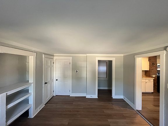 Living room is 13X12 with built ins perfect for a large TV. A closet with storage space on the left. A reading or storage nook on the right with an overhead light and power.