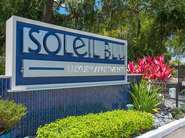 Discover luxury living at Soleil Blu Apartments in St Cloud, FL. Our beautifully landscaped community entrance features a striking modern sign that invites you to experience the comfort and style of resort-style living.