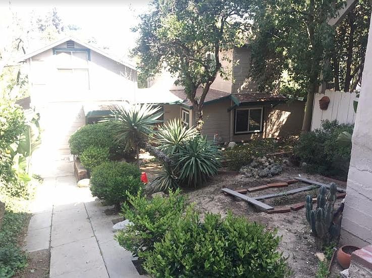 Front yard, renting the place on left.