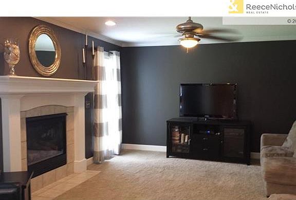 The family room is open to the kitchen and is freshly painted in today's colors.