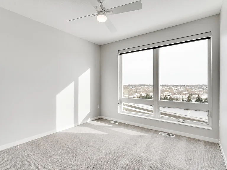 Enjoy stunning views and natural light from your bright, modern bedroom.