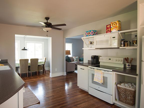 Kitchen with appliances and laundry.