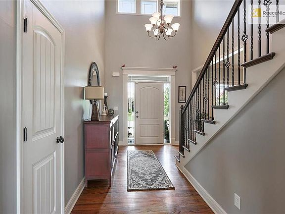 A two-story entry filled with natural light -- the formal dining room is immediately to the left as you walk in the door.