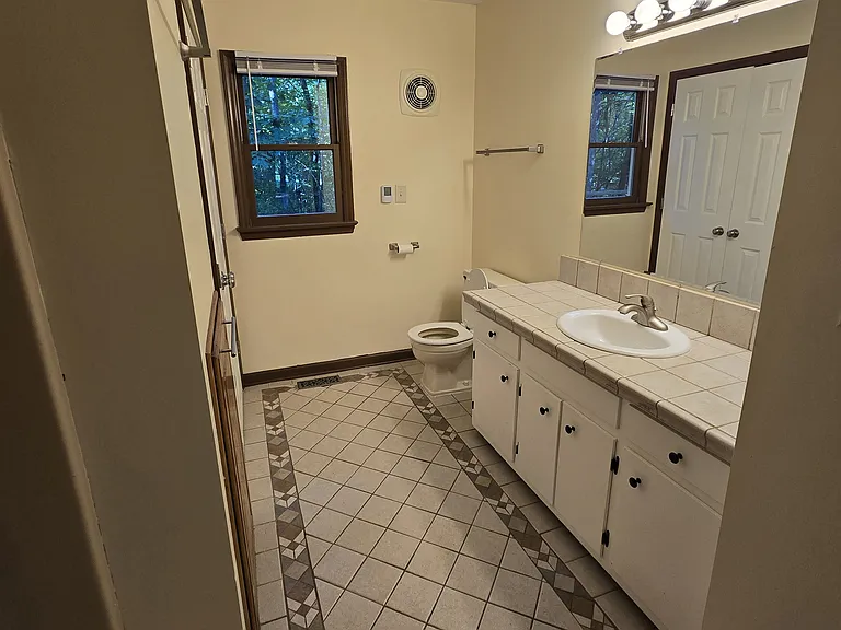 Downstairs bath with shower/tub combination and heated tile