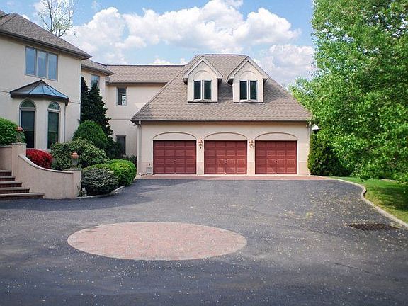 3-Car Garage plus 4th door in rear to add\'l parking space