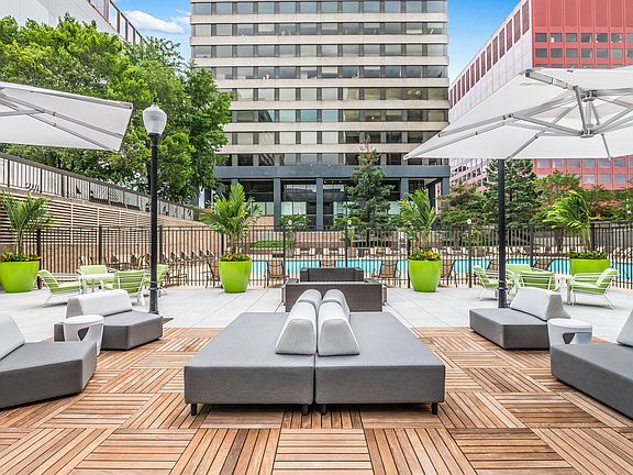 Landscaped Sundeck with Cabanas, Plush Seating, and Lounge Chairs