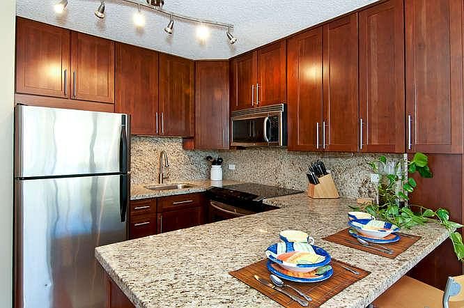 Kitchen with granite counter tops, stainless steel appliance