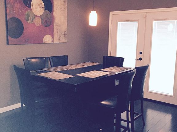 Dinning Room with French Door leading to Fenced Backyard