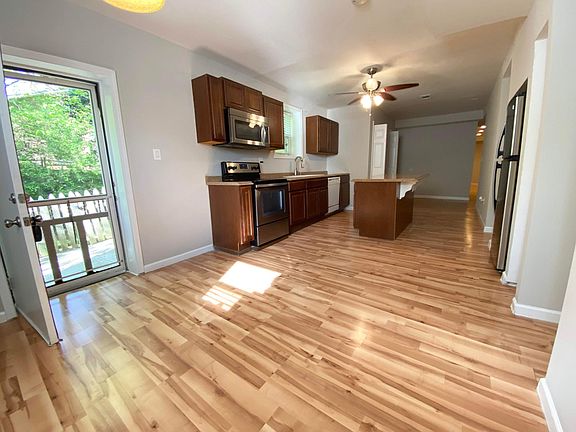 Entryway door which opens to the dining room nook and the kitchen with a nice island.