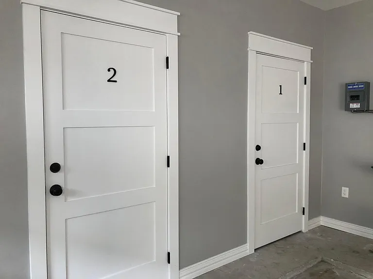 private secured storage located in the garage for each unit