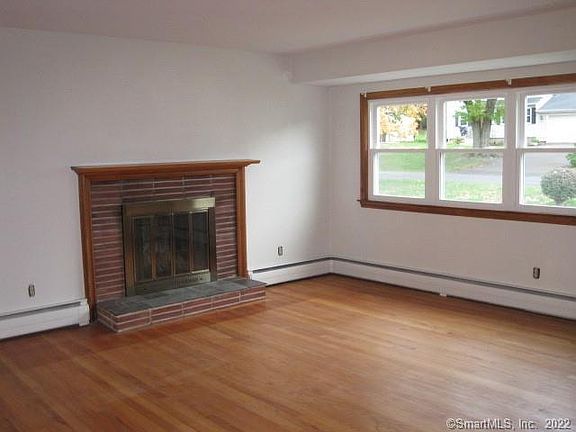 Living Room is boasting with Natural Sunlight and Hardwood Floors