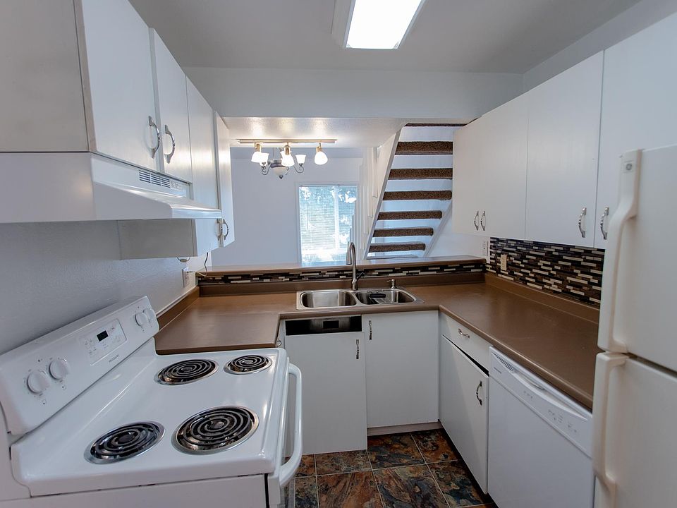 Kitchen with open view area to living and dining area/ patio