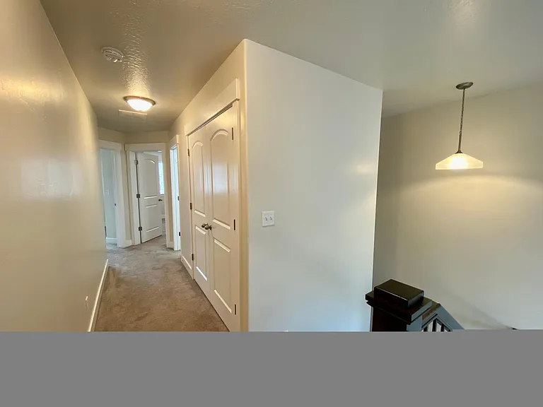 Light and Bright Hallway leading to Other Bedrooms and Laundry
