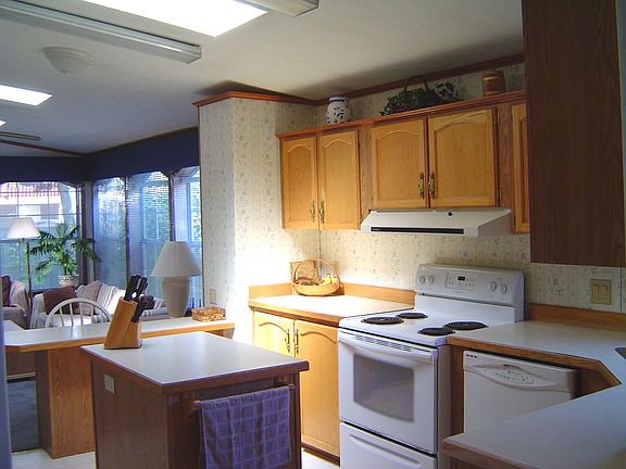 Kitchen with island, breakfast bar, and built-in desk