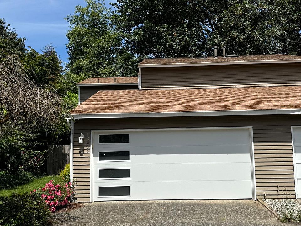 Driveway view - New Steel Garage Door Installed this summer!