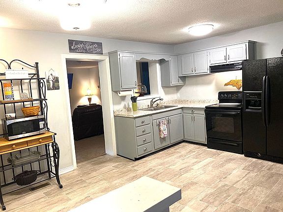 Kitchen opens to living room