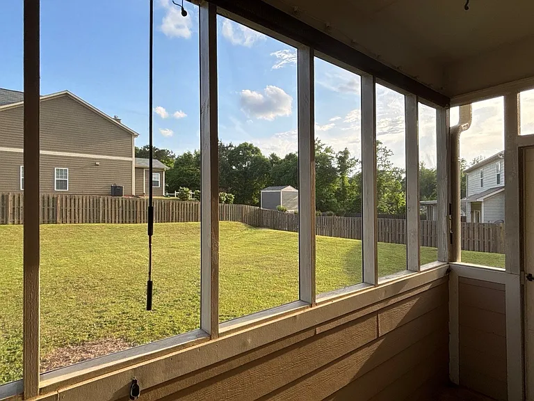 Screened in back porch view to back yard