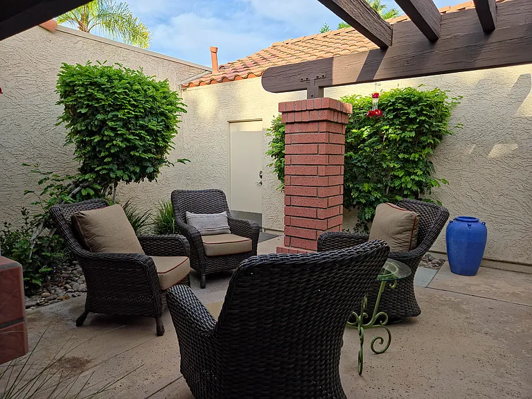 Private front entry courtyard with comfortable seating area.