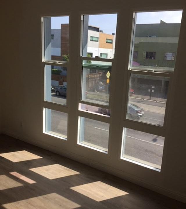 Newly installed bedroom windows with vertical blinds (2ndf loor)