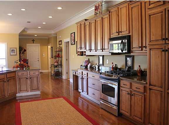 Built in microwave, and lots of warm glazed cabinetry. Kitchen has nice pantry, built in wine rack, 