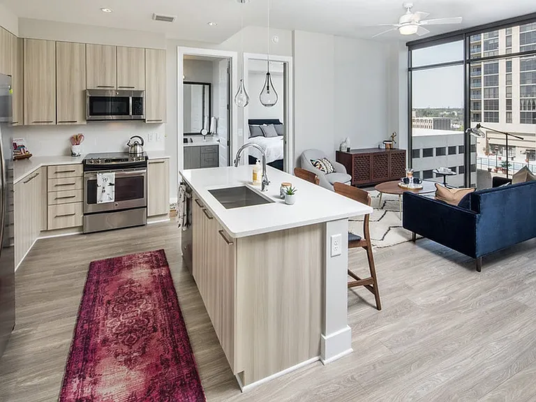 Floor to ceiling windows and ceiling fans in every room