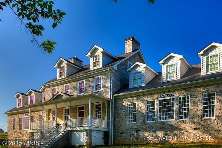 Front facade is 100' long. House is all stone.