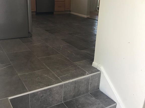 Easy side door entry from parking right to the kitchen