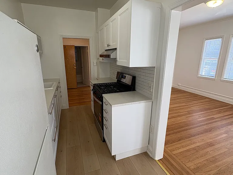 Kitchen opens to large Living Room