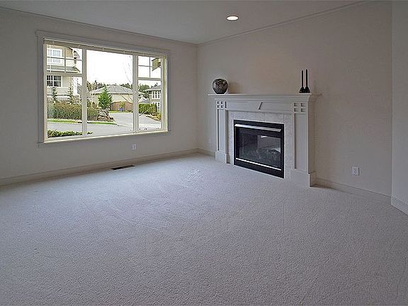 Living rm w/Craftsman inspired gas fireplace