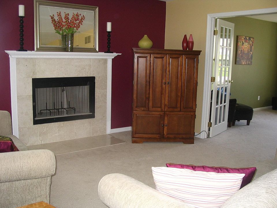 spacious family room opens to living room through double french doors