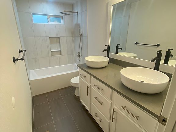 Recently Updated bathroom, heated tile floor, dual sink vanity.