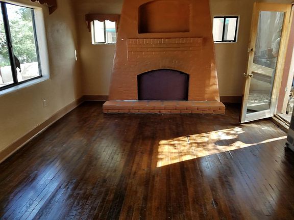 Living room with large wood burning fire place