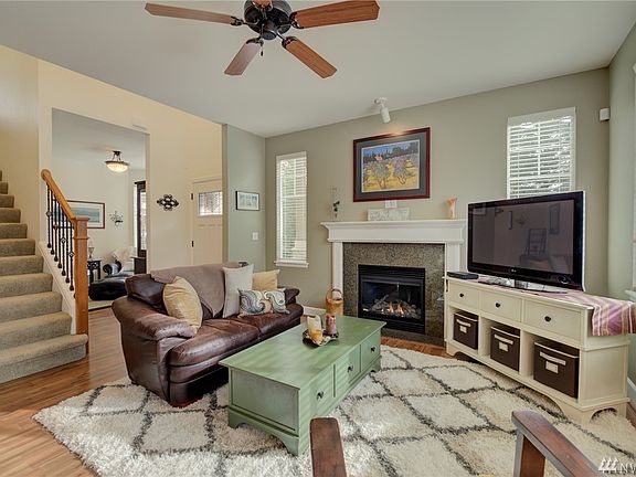 The Great Room style main floor blends this living room area, dining and the kitchen.  A flex room is shown in the background. 